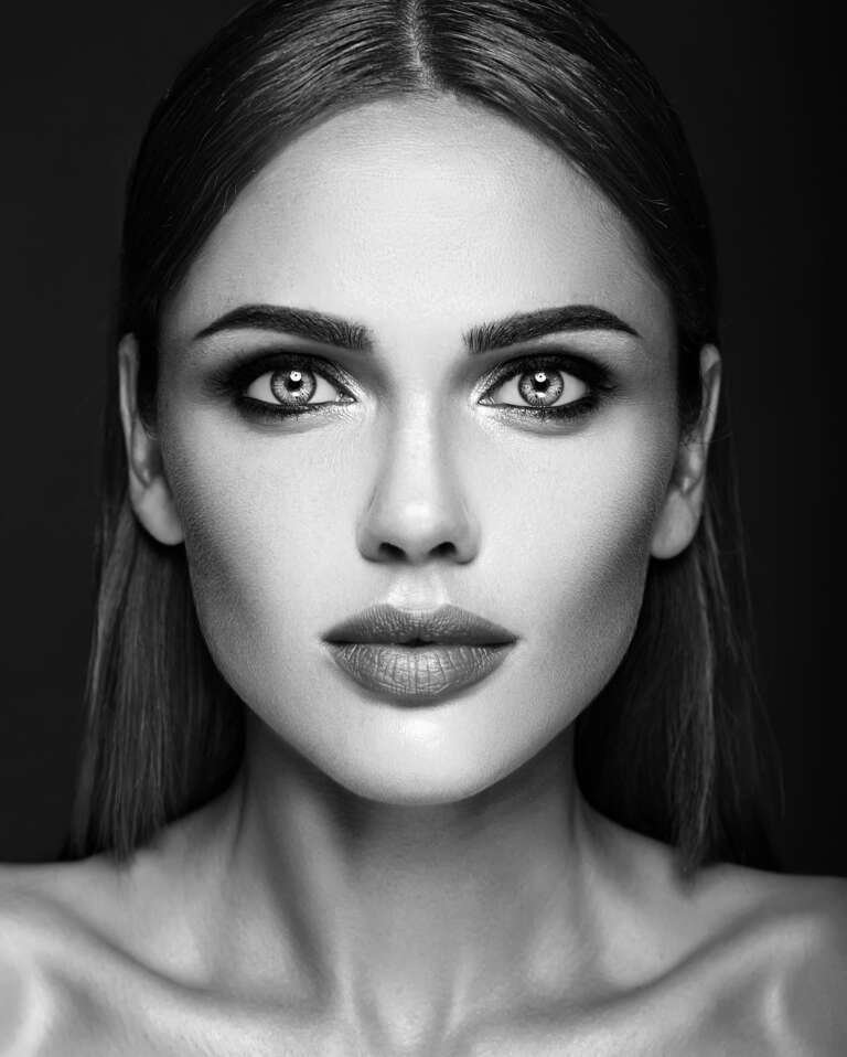 balck and white photo of sensual glamour portrait of beautiful woman model lady with fresh daily makeup and  clean healthy skin face